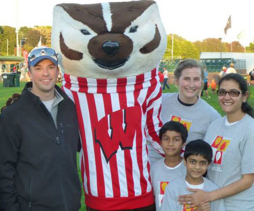 HOPA Volunteer Activity Center image of kids and adults with mascot